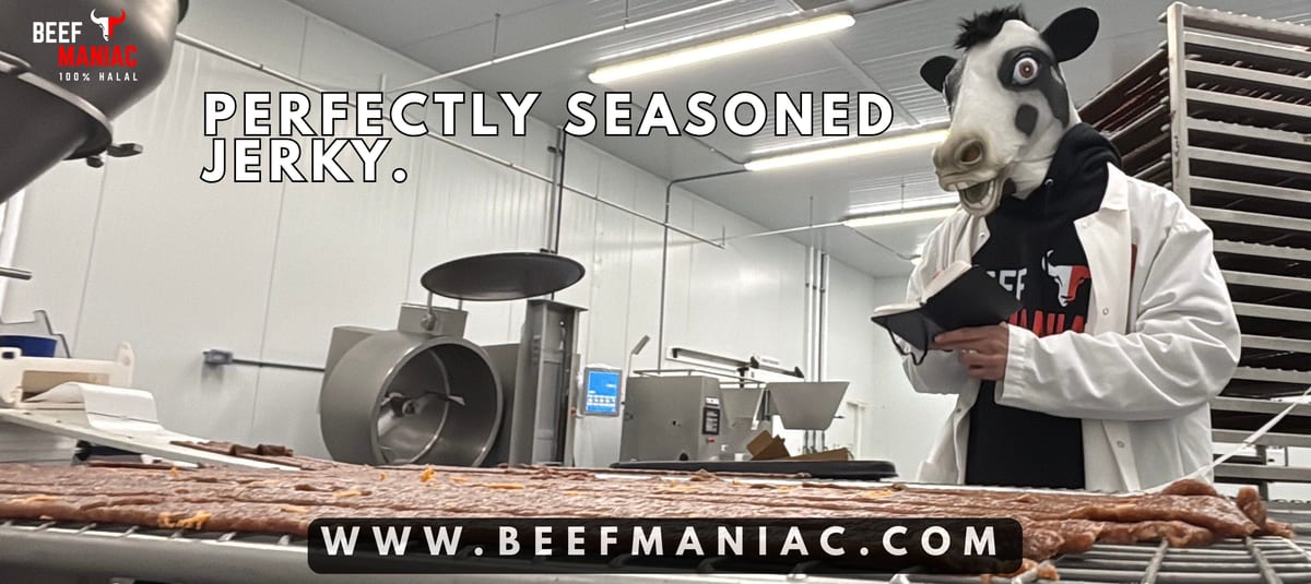 Beef Maniac mascot seasoning halal beef jerky inside the USDA-certified kitchen